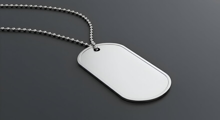 Fototapeta premium Military dog tag with chain on dark background. Blank identification tag hanging from chain, displaying a clean, minimalist design.
