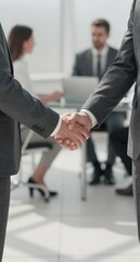 Business Deal Agreement Handshake in Modern Office Meeting Room