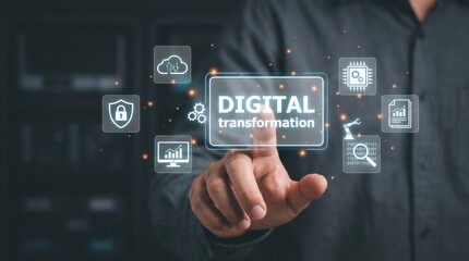 A persons hand touches a digital display with text and icons floating around it on a dark surface in a close up shot