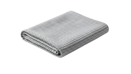 Grey and white woven blanket folded neatly on a transparent background, studio lighting with shallow depth of field, isolated on transparent background