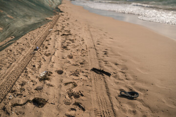 Garbage on the sand of the sea beach