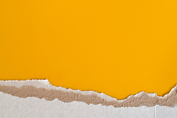 Torn Cardboard Yellow Background With Rough Paper Edge. Abstract background with torn cardboard texture and bright yellow paper. Natural ripped edge creates creative space for text, posters, branding 