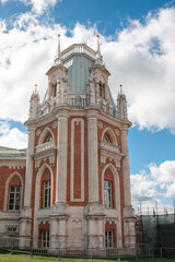 Fototapeta premium Historic Architecture at Tsaritsyno Showcases Beautiful Details and Rich History Beneath a Bright Blue Sky