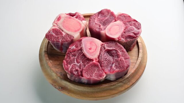 Cooking osso buco with fresh ingredients in a kitchen setting for a hearty meal