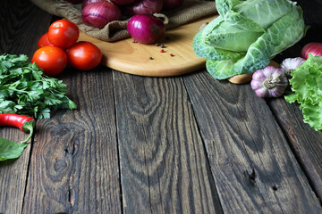 Vegetables on old wooden background overhead close up shoot.