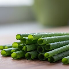 Fresh Green Chives with Water Droplets on a Wooden Surface Illuminated by Soft Natural Light