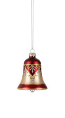 Red and gold bell shaped Christmas ornament with ornate filigree patterns isolated.
