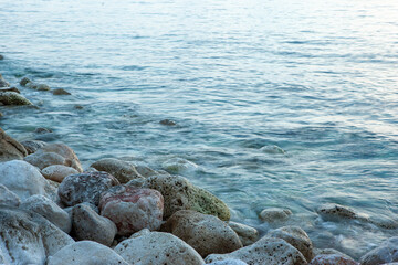 Seascape with stoney beach. Stone coastline. Rocky beach seascape for publication, poster, calendar, post, screensaver, wallpaper, postcard, postcard, banner, cover, website. High quality photo
