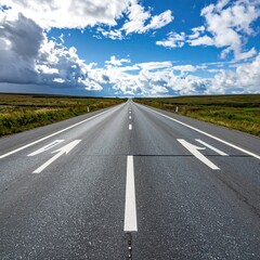 Straight highway stretches into a vast, partly cloudy sky