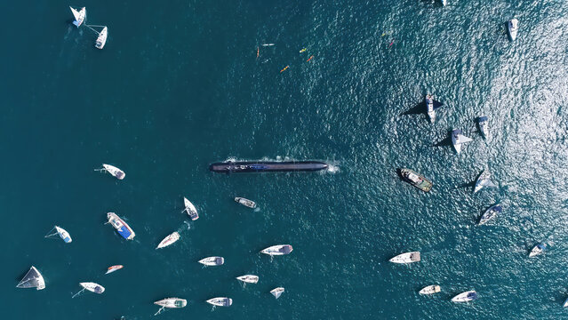 Israeli Navy Submarine Surrounded by Boats

Aerial view of an Israeli Navy Dolphin class submarine on the sea surface, surrounded by civilian sailboats during a maritime event, Israel, November 2025.
