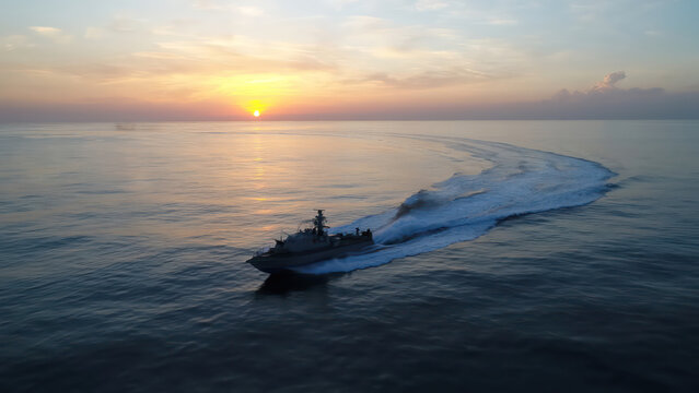 Israeli Navy Saar Missile Boat on high speed at Sunset

Israeli Navy Saar class missile boat sailing calmly during sunset over open sea, Israel, November 2025.
