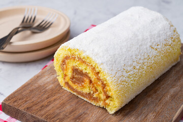 Roll cake or swiss cake filled with dulce de leche