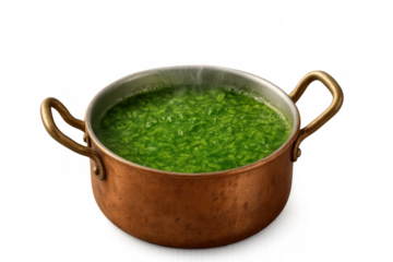 Copper pot filling with hot green vegetable soup, steaming and boiling. Preparing a healthy, fresh, and warm meal