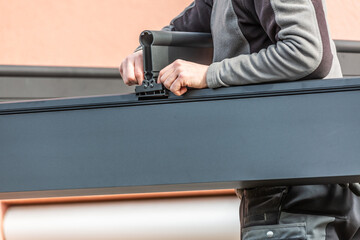 Workers install patio roofing with steel and glass