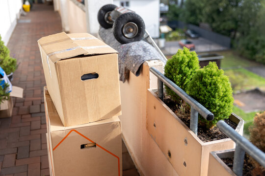 House terrace mover service lift ladder cargo crane platform cardboard box plant pot city street. Retractable furniture elevator machine car pickup truck rental company relocation house move delivery