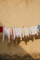 Laundry dries outdoors on a in sunlight