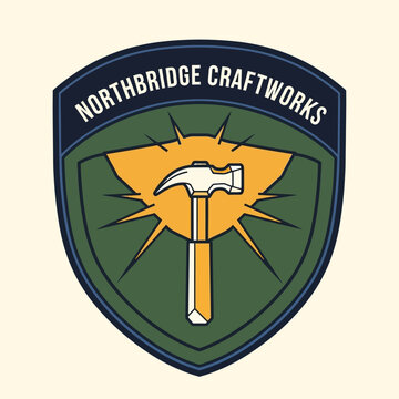 Northbridge Craftworks Logo Featuring Hammer and Sunburst Design.