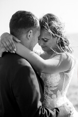 The meeting and walk of the bride and groom on the sandy seashore