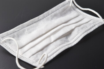 Sanitary mask on black background