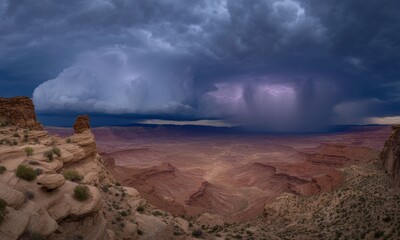 Dramatic storm over a vast canyon
