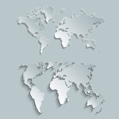 A world map cut out of gray paper. A set of paper world maps on a gray