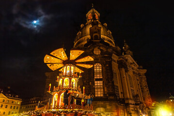 Перейти к странице
|12345...10Далее
Christmas market in Dresden, Saxony, Germany. View of the Frauenkirche, the giant Christmas pyramid, and the moonlit sky.