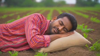 A farmer peacefully sleeping in the middle of his field