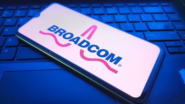 Broadcom logo displayed on smartphone screen resting on laptop keyboard  , New York City, 03 December 2025