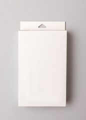 Mockup of white cardboard box for presentation of your product on gray background