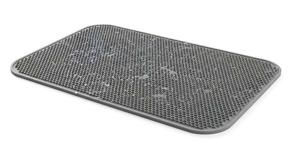 Close-up view of a dark grey textured silicone drying mat with water droplets on a white background.
