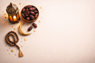 Ramadan Flat Lay with Dates, Islamic Lantern, Crescent Moon and Prayer Beads on Beige Background