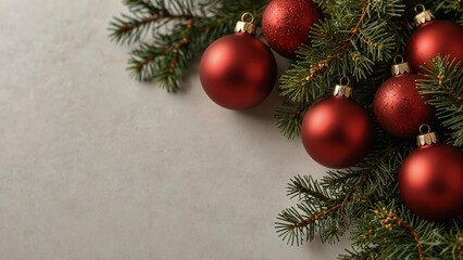Red Christmas Baubles on Evergreen Branch with Minimal Background and Copy Space