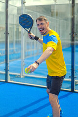 Family team mx. Group of two mix padel tennis players with racket. Woman and man athletes with paddle racket on the blue court. Sport concept. Download a high quality photo for a sports app.