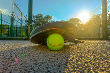Padel tennis racket. Background with copy space. Sport court and ball