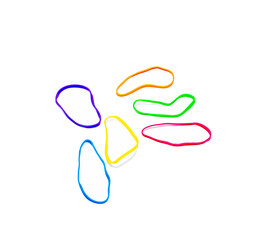 Colorful rubber bands creating a tangled mess on white