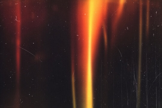 light leak overlay effect with scratch dust and motion blur orange light leaks,retro noisy film texture light leak flare on black background,abstract background with ray,grunge film strip background