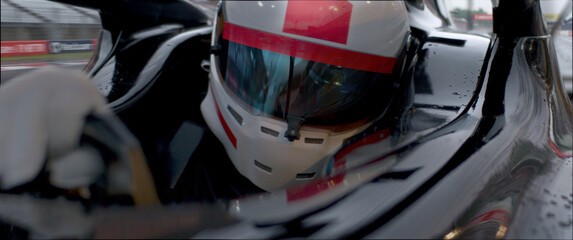 Fototapeta premium A close-up of a race car driver in motion, captured while speeding on a track