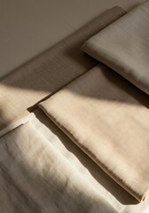 Folded textiles background with warm tones and soft shadows for design