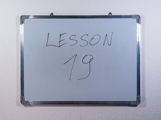 Whiteboard showing LESSON concept representing teaching, explanation and educational content