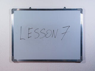 Whiteboard showing numbered LESSON concept representing structured learning and educational progress