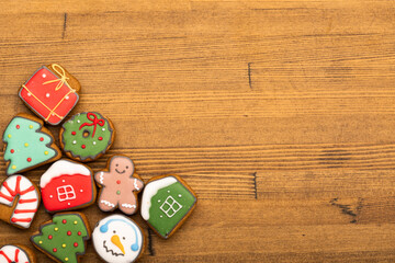 Christmas gingerbread cookies on wooden background