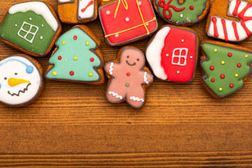 Christmas gingerbread cookies on wooden background copy space