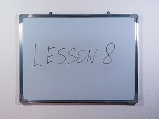 Whiteboard showing numbered LESSON concept representing structured learning and educational progress