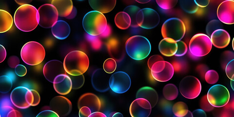 vibrant colorful bokeh lights abstract background with glowing blurred circles in pink blue green yellow orange on black