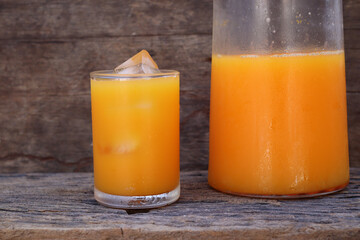 Soft drinks orange juice and iced in glass