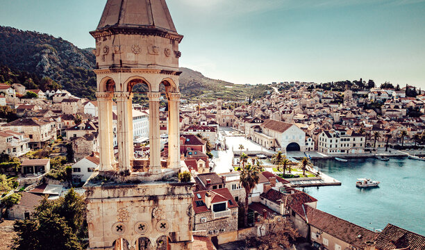 Aerial view of the ancient bell tower against the backdrop of terracotta roofs and turquoise waters, Split, Split-Dalmatia County, Croatia.
