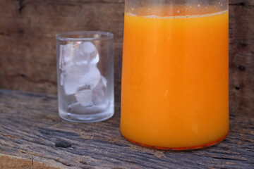 Soft drinks orange juice and iced in glass