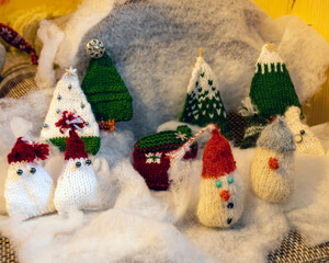 Christmas decorations from various knitted items, gnomes, snowmen, trees and houses, beautiful card, festive mood