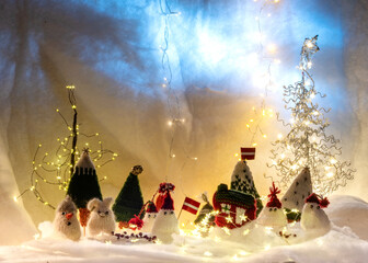 Christmas decorations from various knitted items, gnomes, snowmen, trees and houses, beautiful card, festive mood