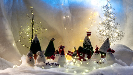 Christmas decorations from various knitted items, gnomes, snowmen, trees and houses, beautiful card, festive mood